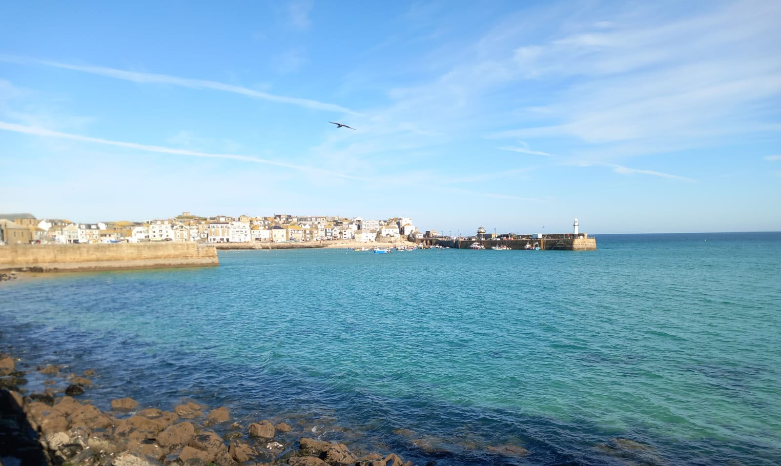 A picture taken of the water and St Ives harbour.