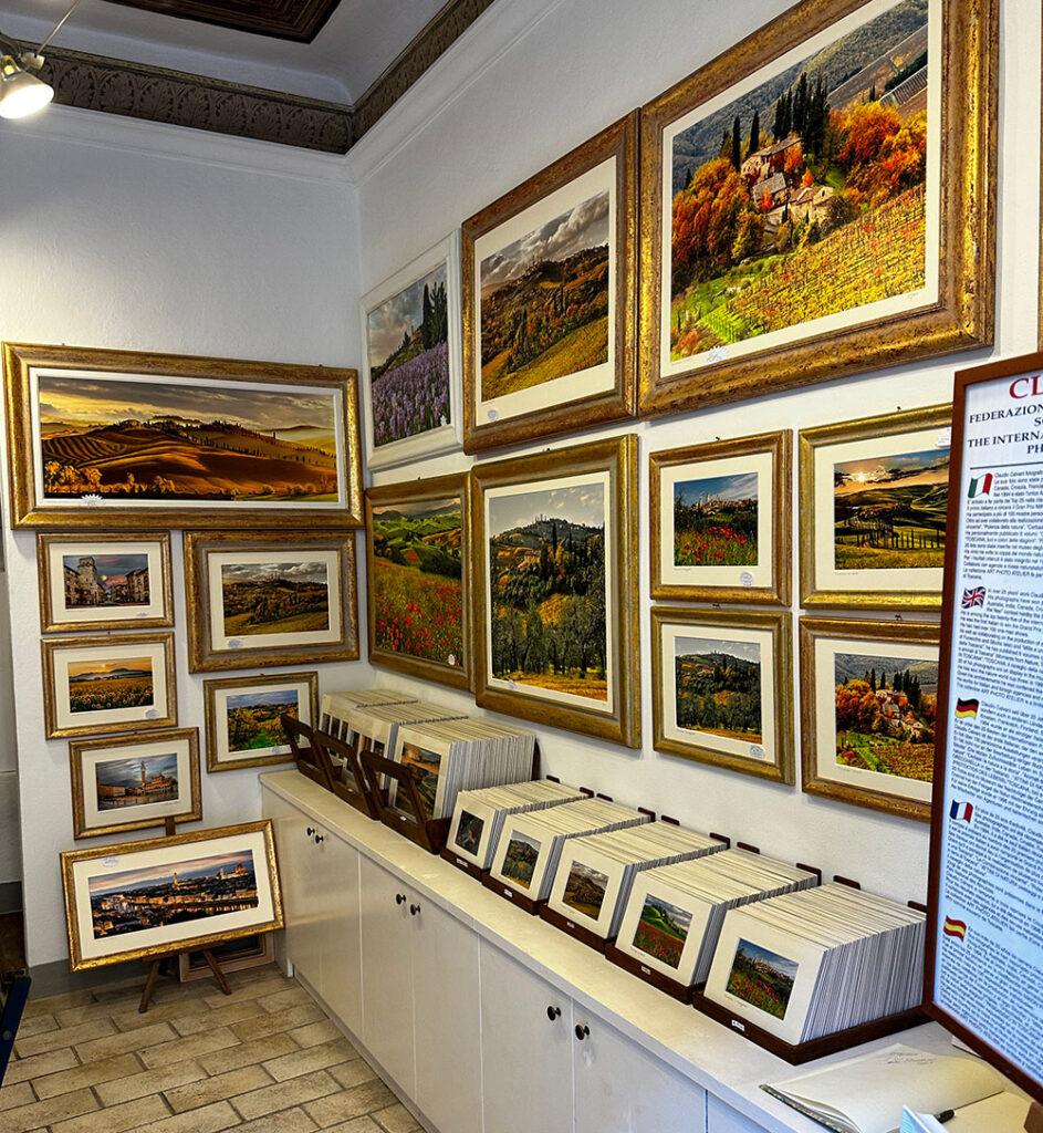 A gallery showing many landscape paintings of San Gimignano in Tuscany, Italy